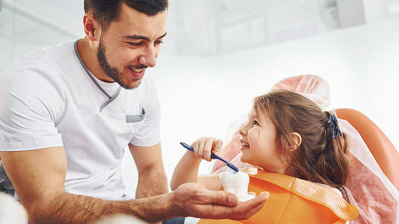Dentist with young patient