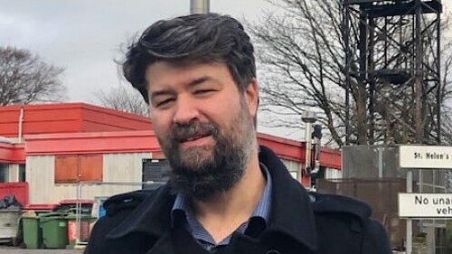 Cllr Ben Rose outside St Helen's Primary School.