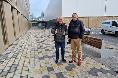 Vaughan Moody with thumbs up next to Ben Langmead outside Allander Leisure Centre