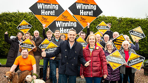 Alex Cole-Hamilton and Susan Murray in front of a group of Lib Dem activists