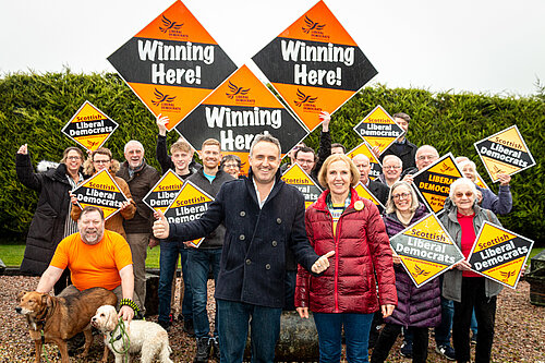 Alex Cole-Hamilton and Susan Murray in front of a group of Lib Dem activists